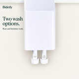 Bidetly dual nozzles for rear and feminine wash